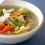 chicken soup with carrot, potato and herbs