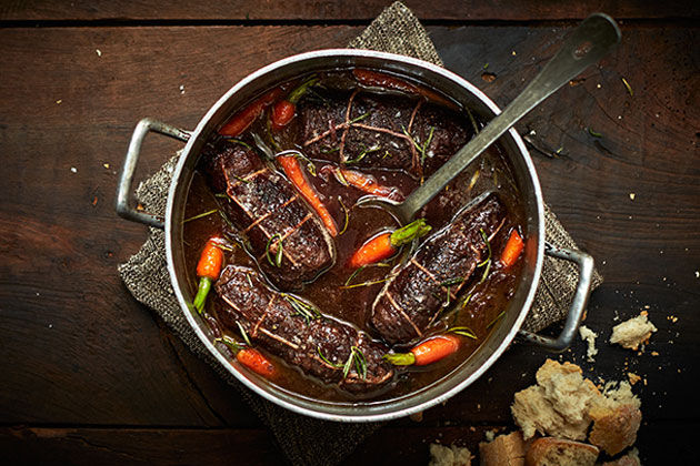 beef wrapped up in a stew with carrots