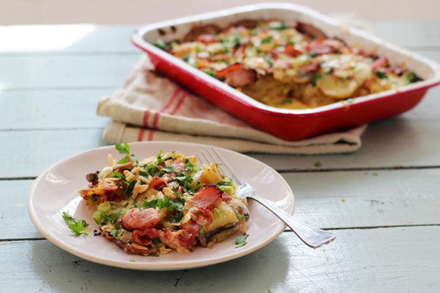 potato gratin with cheese and bacon and coriander on top