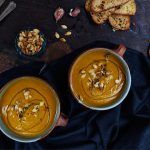 roasted pumpkin soup with bread on the side