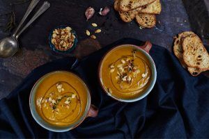 roasted pumpkin soup with bread on the side