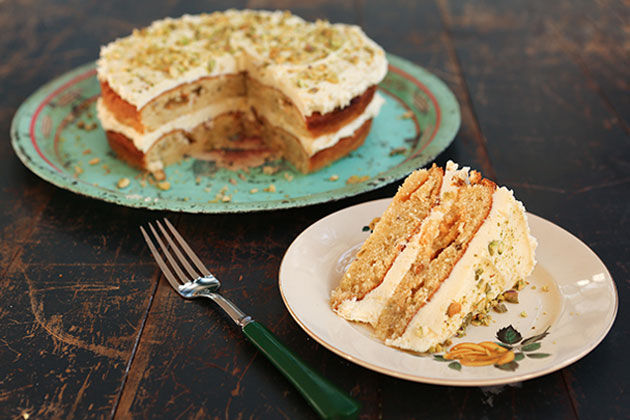 pistachio and white chocolate cake with pistachio crumbs on top