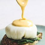 perfect hollandaise sauce on top of poached egg on toast