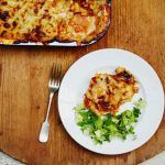 lasagne on a plate with salad