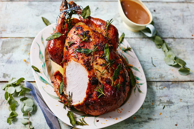 perfect turkey for christmas day with lemon and herbs on top