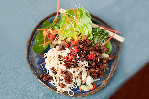 Fakeaway recipes: asian spicy beef noodle dish with salad and chilli