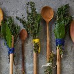 herb brush attached to wooden spoons