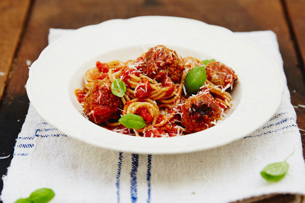 meatballs with spaghetti and basil on top