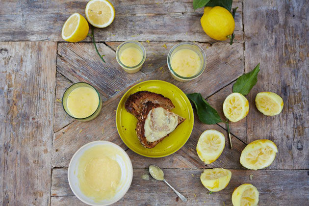 lemon curd recipe with slices of lemons beside
