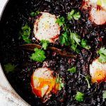 Pan filled with black beans and poaches eggs