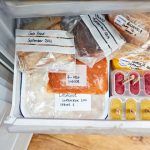 freezer drawer containing food all bagged with labels