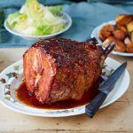 roast ham with glaze on table