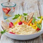 houmous dip with chopped veg, carrots, peppers, radishes and pitta bread