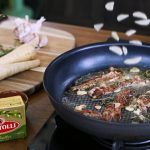 bertolli butter cooking garlic and bacon with parsnips on the side