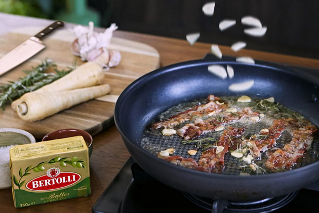 bertolli butter cooking garlic and bacon with parsnips on the side