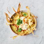 A seasonal November recipe: Bowl of parsnip soup with coriander and parsnip crisps on top