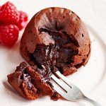 chocolate fondant pudding with raspberries on the side