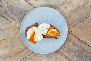How to poach an egg - poached egg on top of toast