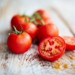 tomato recipe - chopped cherry tomatoes on a board