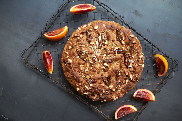 banana bread recipe feature - banana bread with walnuts surrounded by figs