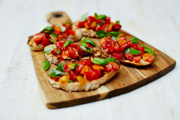 vegan summer recipe feature - tomato bruschetta with basil on top
