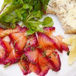 salmon recipe for gravlax with lemon, salad and bread with butter