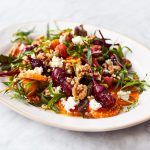 Beetroot recipes - Colourful, dressed beetroot salad on a white plate
