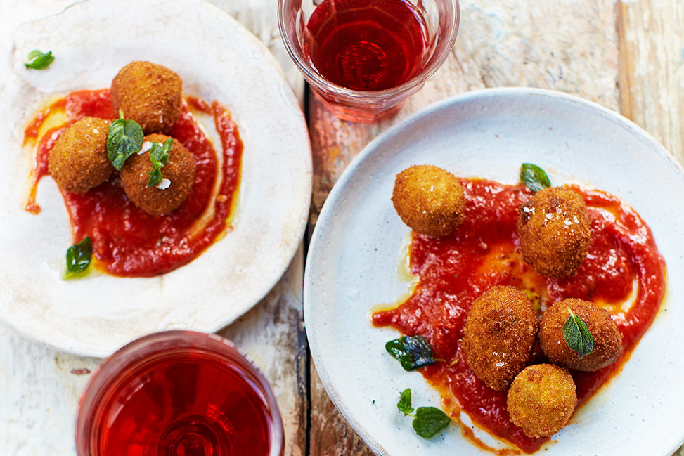 Fried olive tapas with tomato sauce