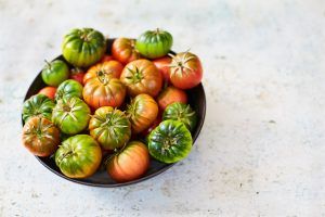 Red and green tomatoes - seasonal July ingredient