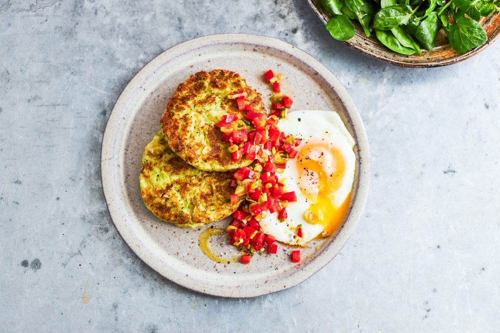 Veg patties with a fried egg and a spoonful of tomato salsa