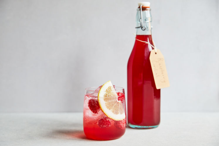 Delicious raspberry recipes - A bottle and glass of summer cordial