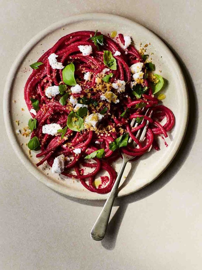 Beetroot bucatini on a plate with a fork
