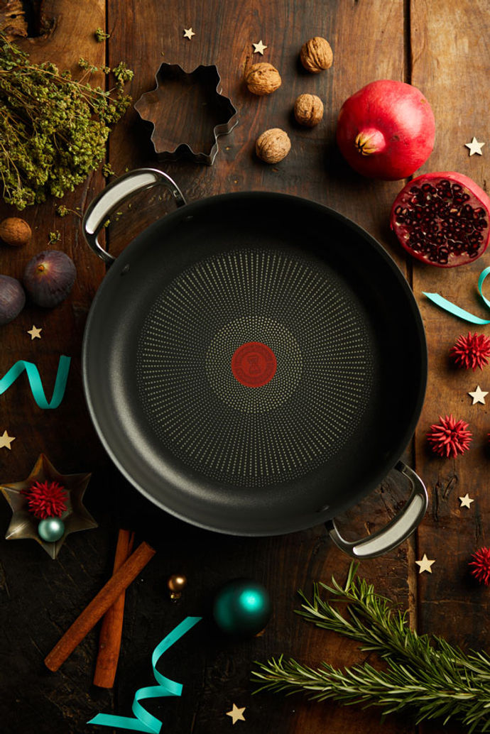 Tefal All in One pan with pomegranate, figs and Christmas decorations around it