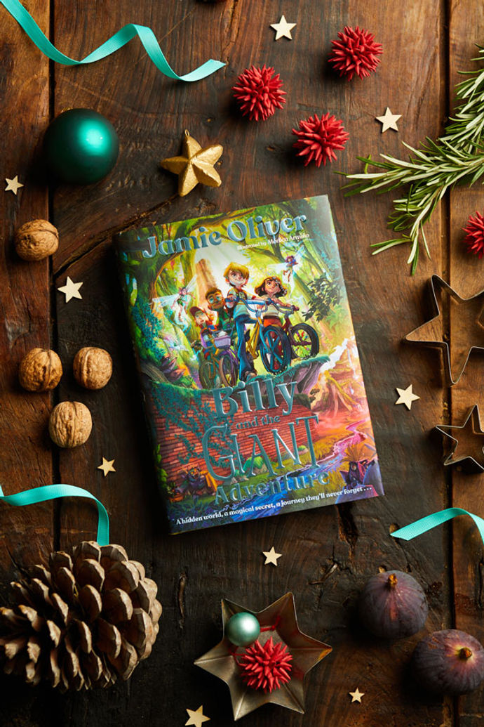 Billy and the Giant Adventure book surrounded by chestnuts, pinecones and Christmas baubles