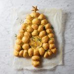 Tear n share garlic bread dough balls in the shape of a Christmas tree with a baked camembert in the middle - the perfect party food idea!