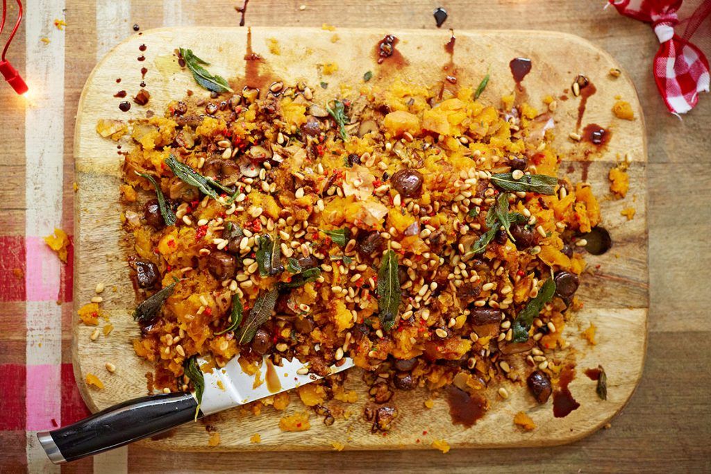 Chopping board with mashed butternut squash and sage for a delicious, healthy Thanksgiving recipe
