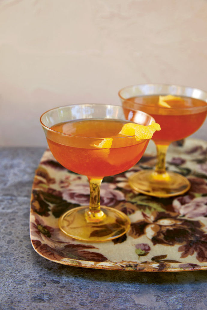 Two glasses of Apricot Sidecar cocktail on a tray