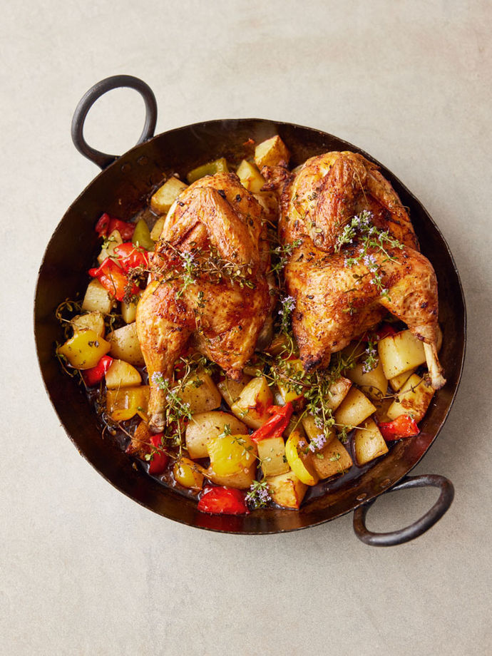 Cast-iron pan with crispy paprika chicken, potatoes and peppers