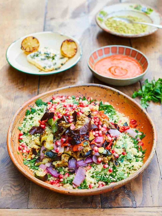 A couscous and herb salad with grilled courgette, aubergine and pomegranate.