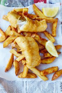 Fish and chips with two slices of lemon