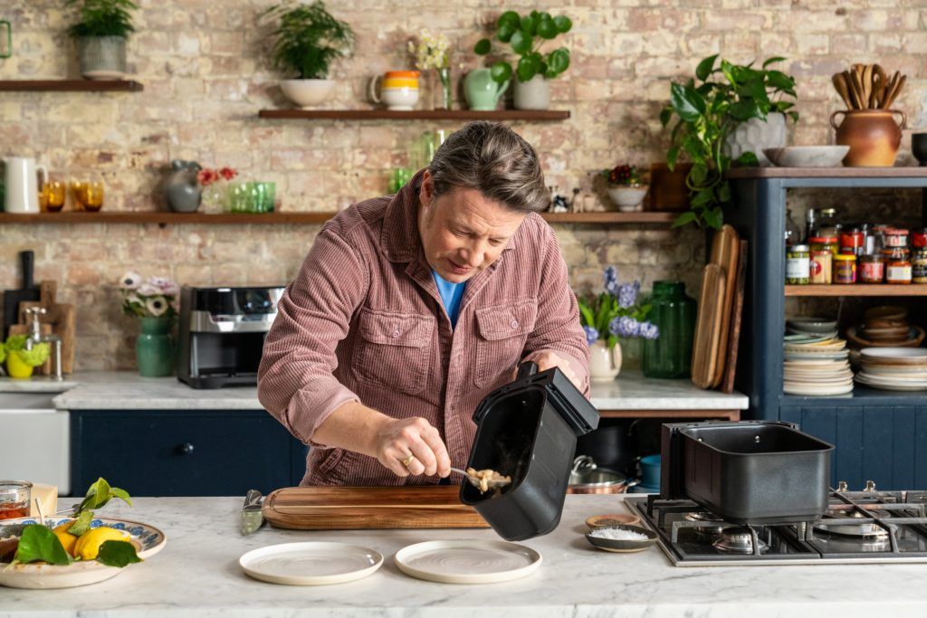 Jamie Oliver dishing from a Tefal air fryer
