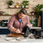 Jamie Oliver dishing from a Tefal air fryer
