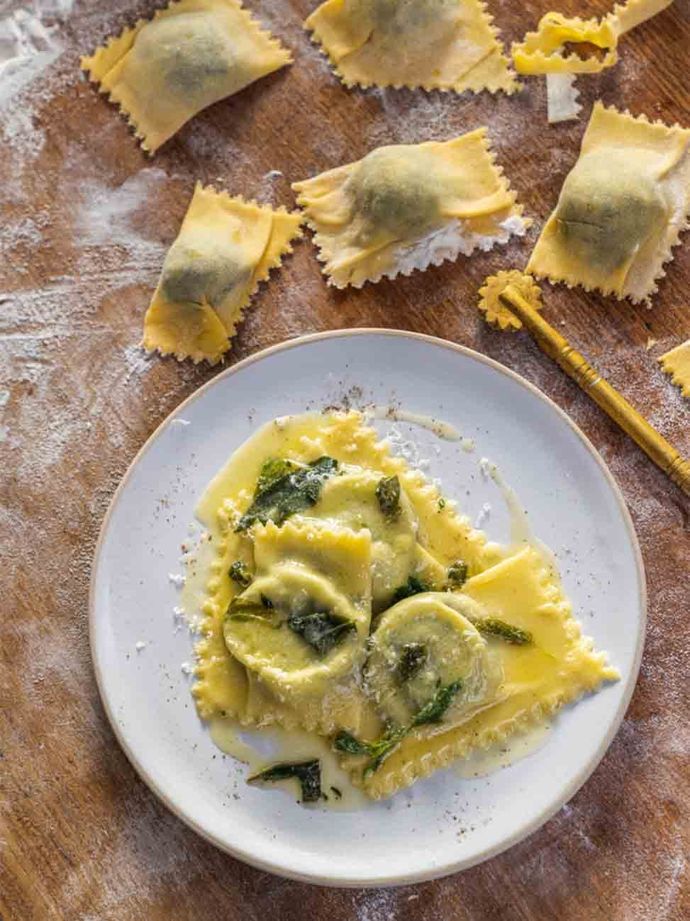 Spring greens ravioli from Jamie Cooks Spring. Topped with extra greens and Parmesan cheese.