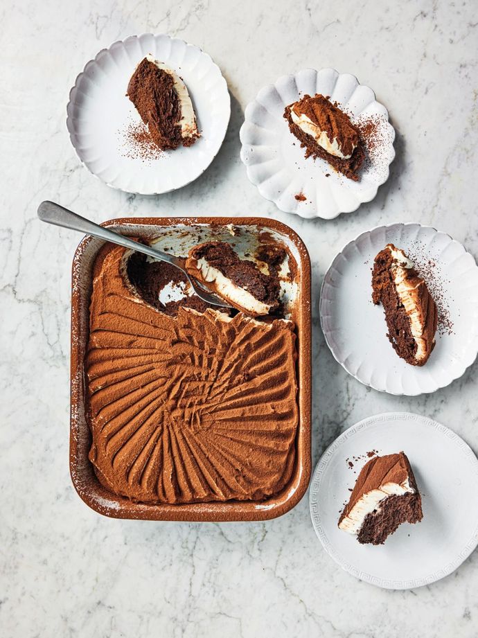 A tray of chocolate sponge tiramisu. There are four plates around the tray with fours servings. Recipes from Simply Jamie cookbook