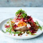 baked sweet potato with lettuce and beetroot shredded on top