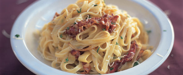 carbonara recipe, pasta with meat, cheese and herbs on top