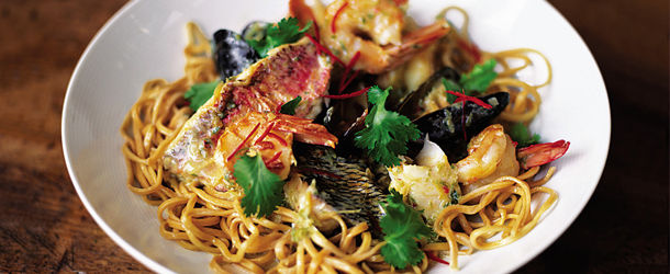 seafood noodle recipe with herbs and spices on top