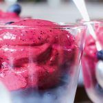 fruit smoothie ice cream with fresh blueberries in bowls