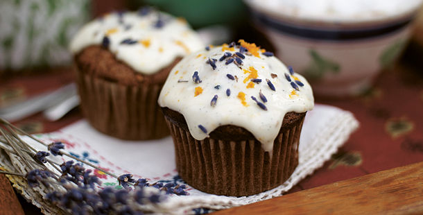 cupcakes with icing on top and lavender with orange zest