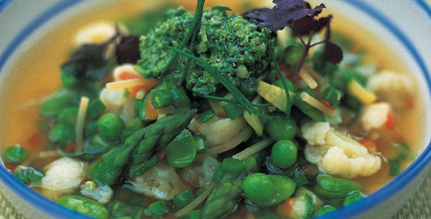 fresh vegetables in a winter soup with asparagus and peas